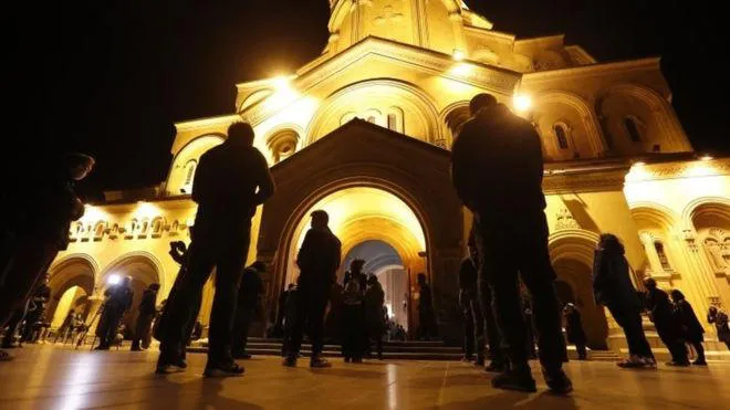 BBC - Parishioners were welcomed at Tbilisi's Sameba Cathedral despite a curfew