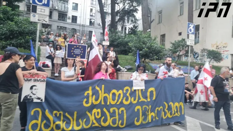A protest is taking place at the back entrance of the Parliament