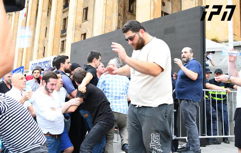 Activists of demonstration against Tbilisi Pride throw bottles at Misha Mshvildadze