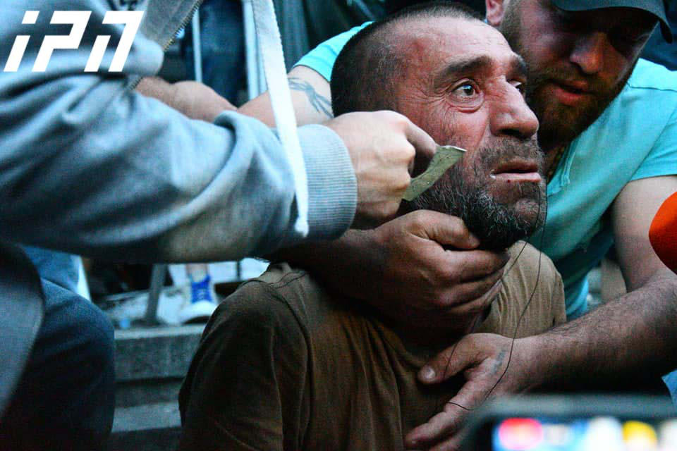 Protester tries to sew his mouth shut