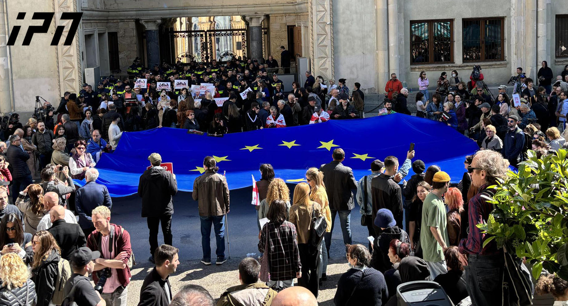 The European Union flag was unfurled at the demonstration at the back ...