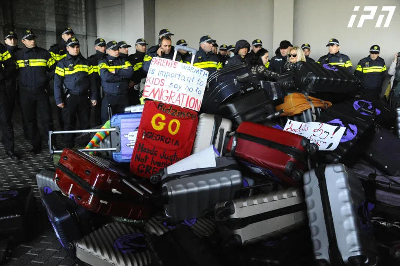 Women's March participants symbolically left suitcases near Bidzina Ivanishvili's house and chanted: "Go!"