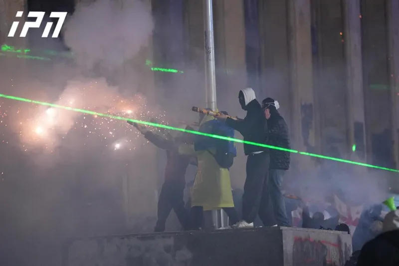 The police periodically use water cannons against the demonstrators, and the protestors throw pyrotechnics against the police