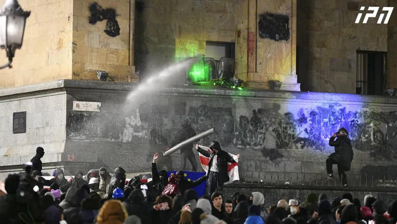 Water jets are used against the protesters on the perimeter in front of the Parliament