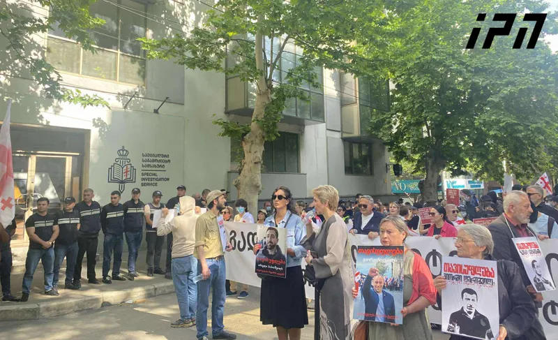 A protest is taking place outside the Special Investigative Service building