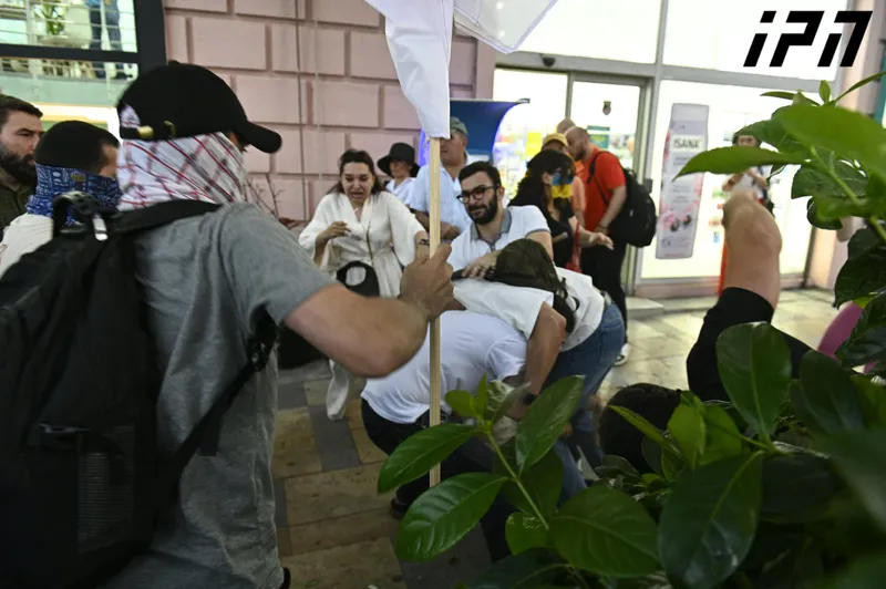 During the protest march toward Parliament, a verbal and physical confrontation occurred between the rally participants and Russian-speaking passersby