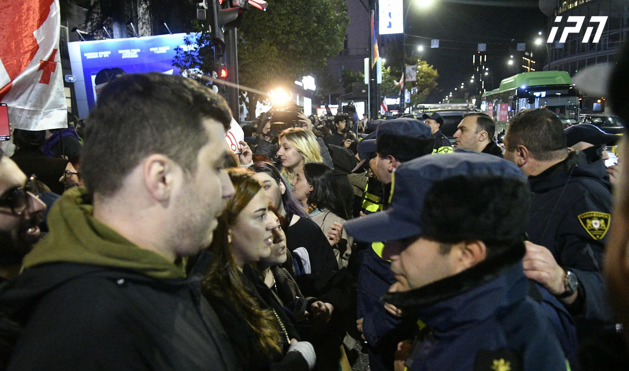 Law enforcement officers detain one of the participants of the solidarity march, Ketevan Khuskivadze